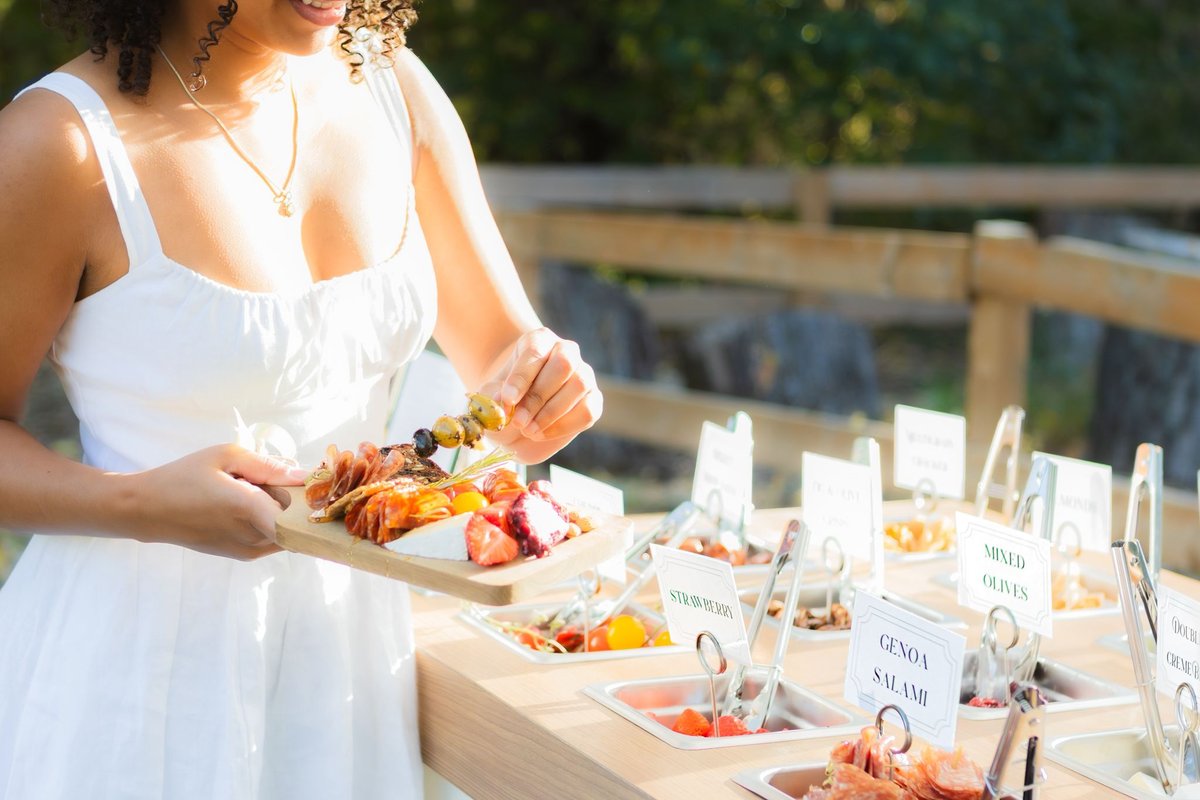 Anniversary celebration charcuterie station with warm, intimate styling